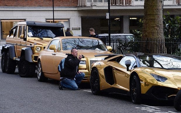 Three gold cars from Saudi Arabia (left-right) a 6x6 Mercedes G 63, Rolls-Royce Phantom Coupe and Lamborghini Aventador have received parking tickets on Cadogan Place in Knightsbridge, London. PRESS ASSOCIATION Photo. Picture date: Wednesday March 30, 2016. See PA story TRANSPORT Knightsbridge. Photo credit should read: Stefan Rousseau/PA Wire